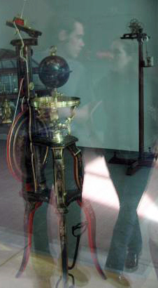 Alex Wellerstein (left) and Ellen Bales (right), reflected in the window of the Collection of Scientific Instruments, Harvard University.